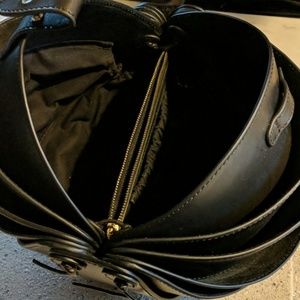 Black leather round purse.